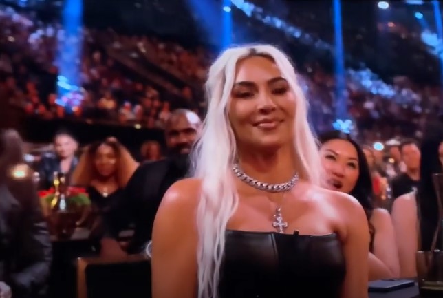 Kim Kardashian reacts to Tom Brady's Kanye joke at Netflix roast. Image Credits: Netfix