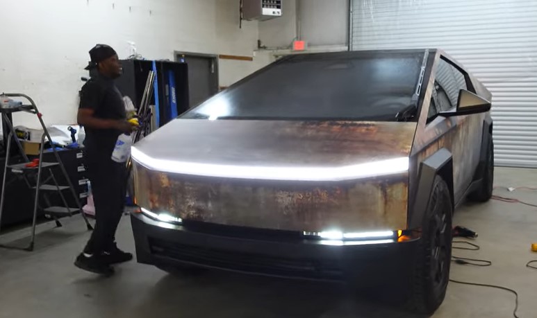 YouTube channel WhipAddict showcased a rust wrap on the Cybertruck, installed by Luxe Concepts for T.I. Image Credits: WhipAddict