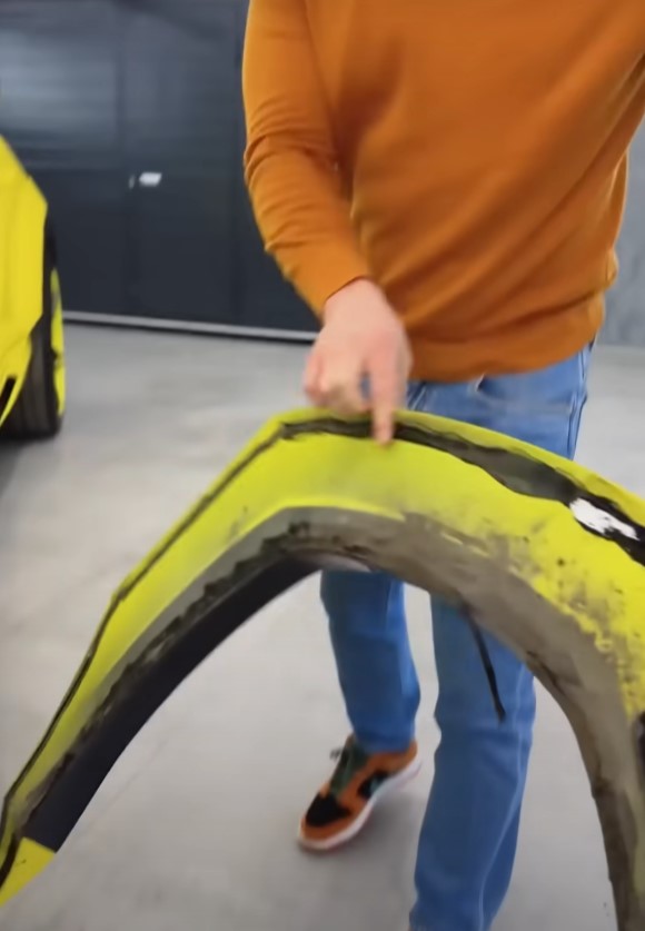 A man easily dismantling a Lamborghini, sparking similar authenticity debates. Image Credit: YouTube/JETCAR