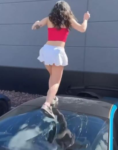 A TikTok user smashes a Lamborghini window while dancing, shocking viewers. Image Credits: TikTok/@snowbunnyjelly