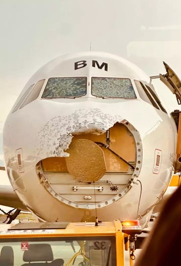 Passenger jet miraculously lands despite hailstone damage 4