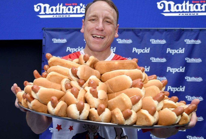 Despite his fame, Chestnut is excluded this year due to a vegan hot dog dispute.  Image Credits: Getty