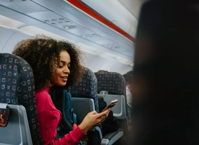 Wearing red while flying can provide travelers with advantages. Image Credits: Getty